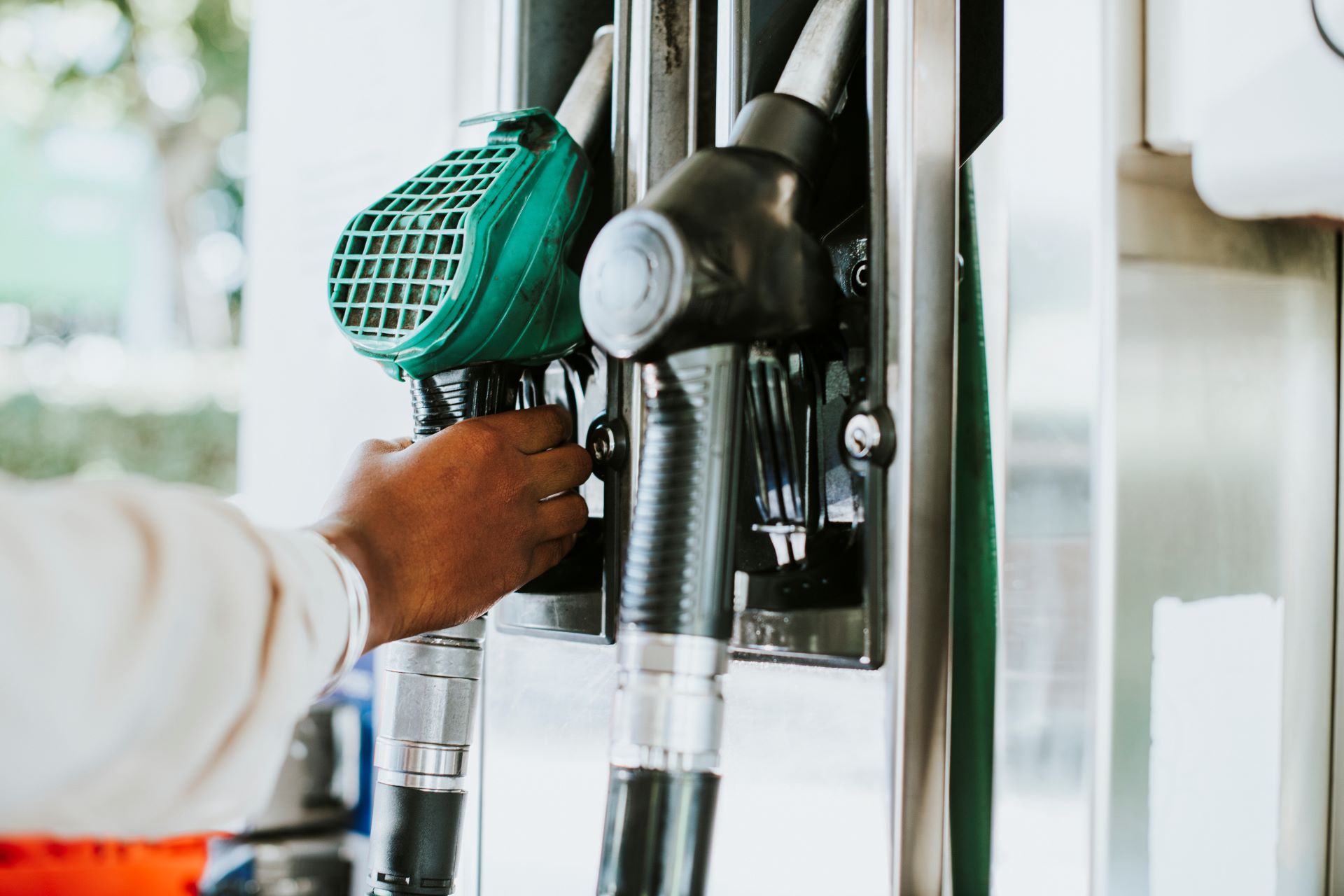 man-grabbing-fuel-nozzle-refuel-his-vehicle